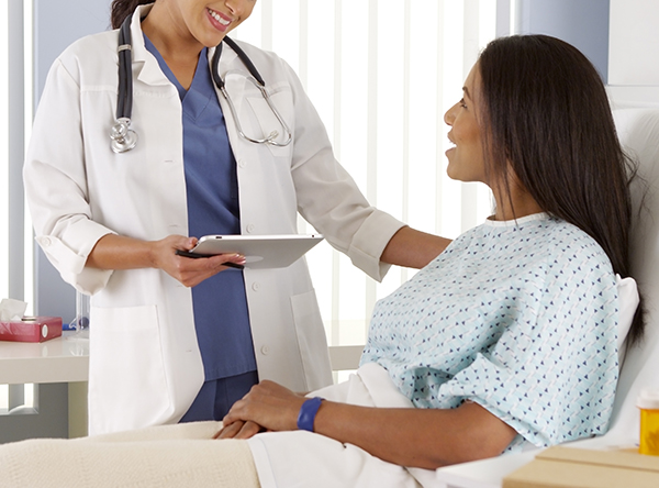 female doctor talking to patient